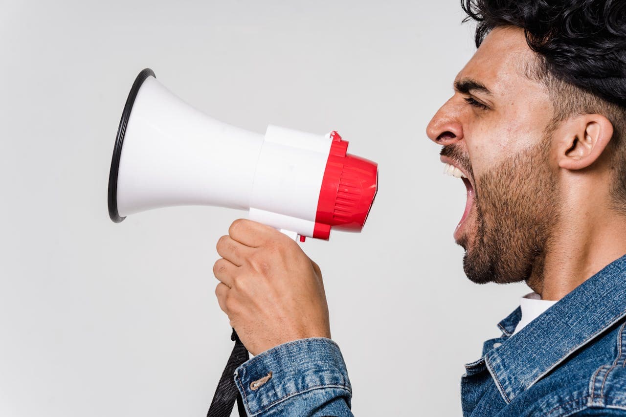 Man with megaphone representing content noise